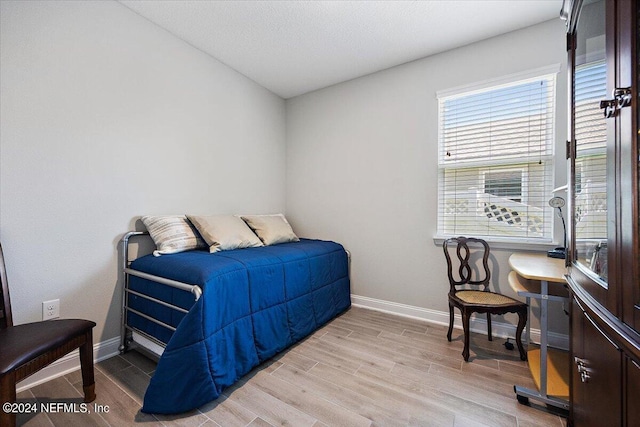 bedroom with light hardwood / wood-style floors