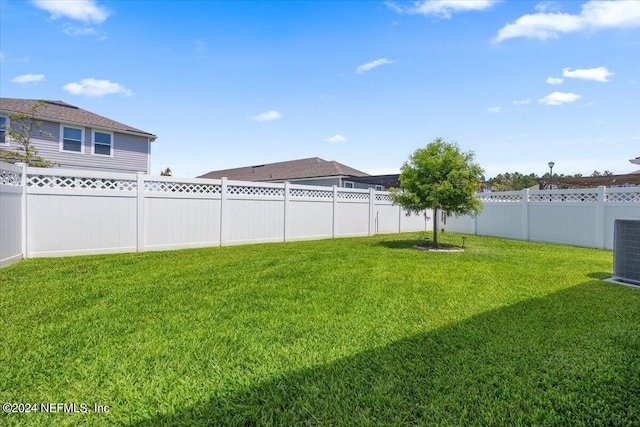 view of yard with central AC