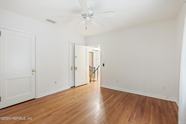 unfurnished room featuring ceiling fan and light hardwood / wood-style floors