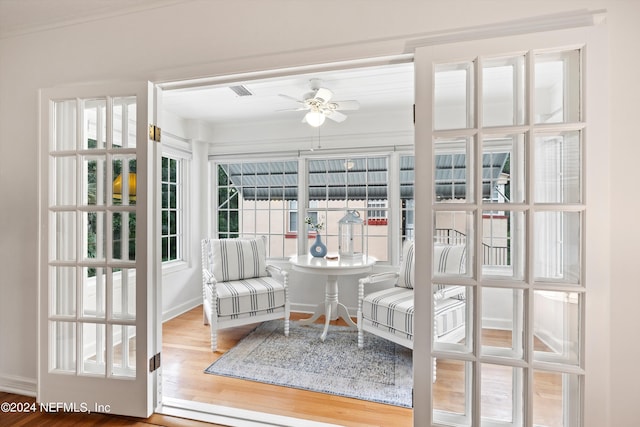 sunroom / solarium with ceiling fan