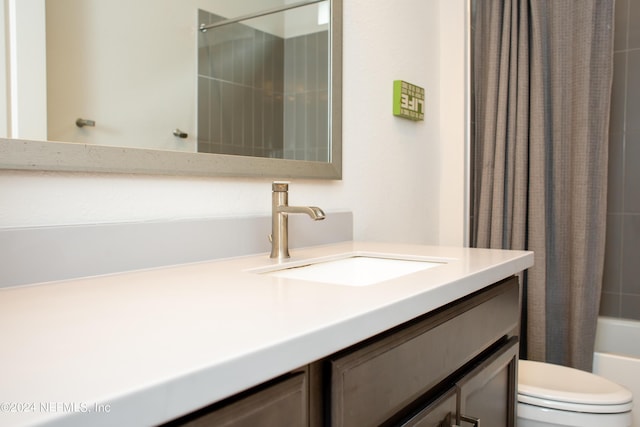 full bathroom featuring vanity, toilet, and shower / tub combo