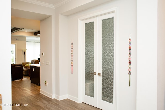 hall featuring crown molding and wood-type flooring