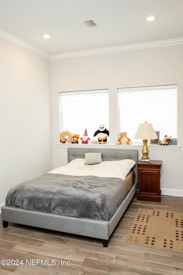 bedroom with ornamental molding