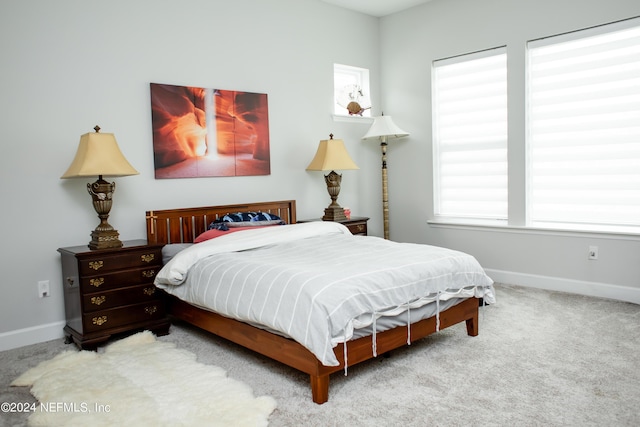 bedroom with light carpet