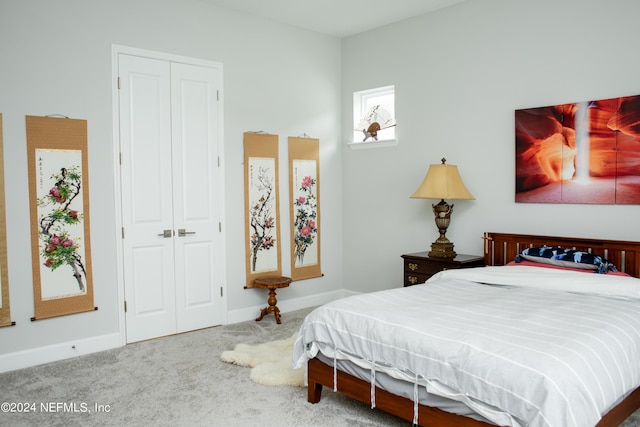 bedroom with carpet and a closet