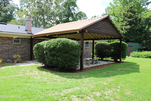 view of yard featuring an outbuilding and a shed