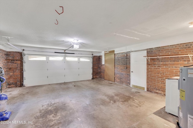 garage featuring water heater and a garage door opener