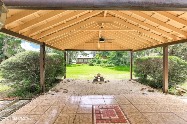 view of patio with a ceiling fan and a gazebo