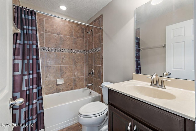 full bathroom with vanity, shower / tub combo, a textured ceiling, and toilet