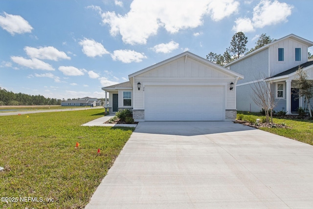 view of front of house featuring driveway, a garage, a front lawn, and board and batten siding