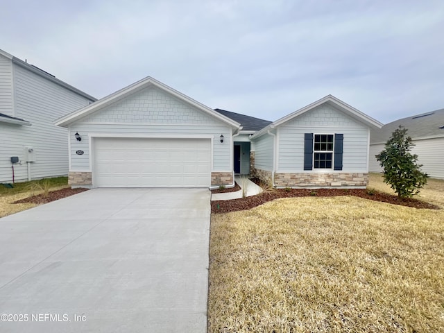 view of front of home with a front lawn and a garage