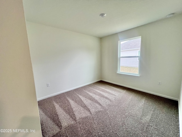 unfurnished room featuring carpet flooring