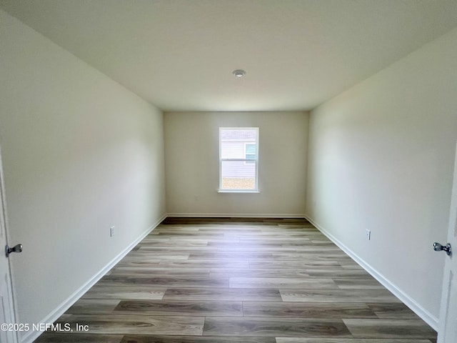 unfurnished room featuring light hardwood / wood-style floors