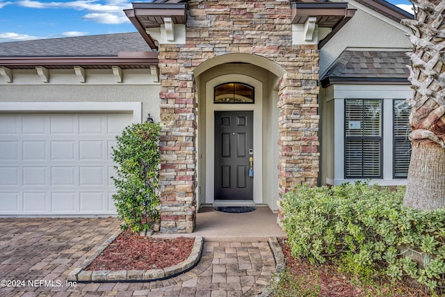 property entrance with a garage