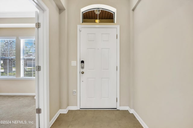 interior space featuring light tile patterned floors and plenty of natural light