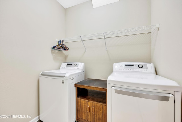 washroom featuring washer and dryer