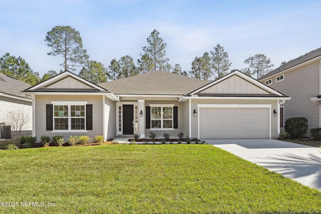 ranch-style house featuring a garage and a front lawn