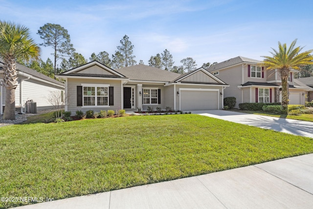 single story home featuring a garage and a front yard