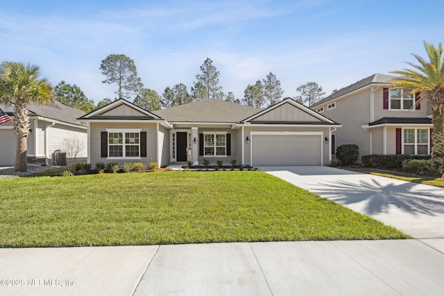 view of front facade featuring a front yard and a garage