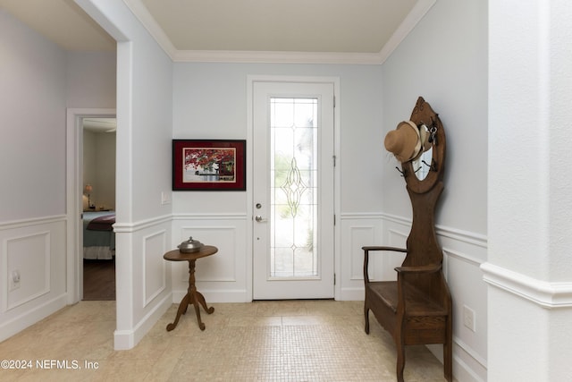 tiled entrance foyer with ornamental molding