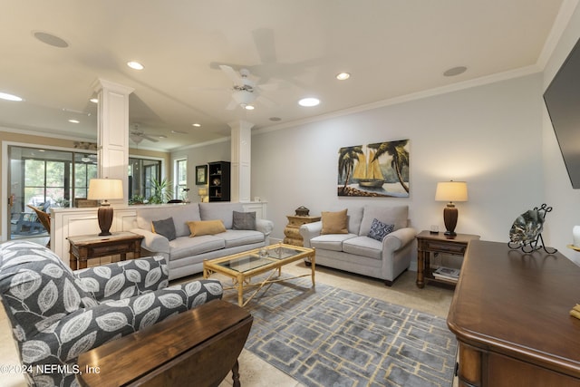 living room with ceiling fan, crown molding, and decorative columns