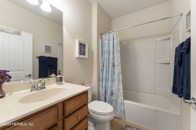 full bathroom featuring shower / bath combo, vanity, and toilet