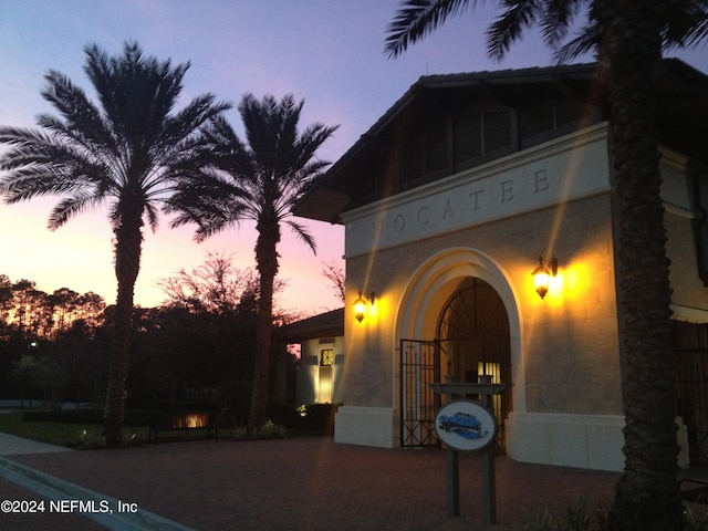 view of exterior entry at dusk