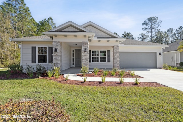 view of front of house featuring a front lawn and a garage