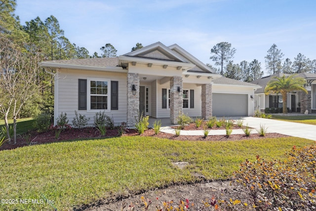 view of front of house with a garage and a front lawn