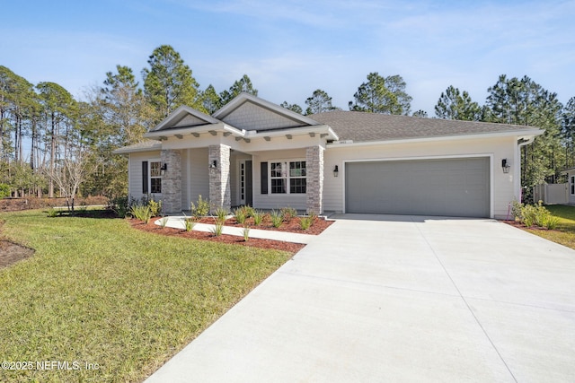 view of front of house with a garage and a front lawn