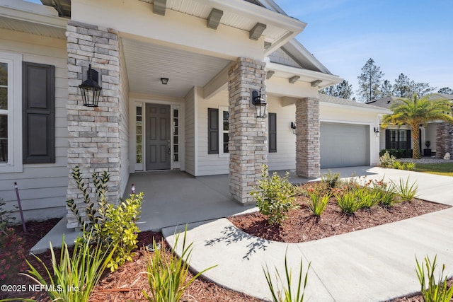 view of exterior entry featuring a garage