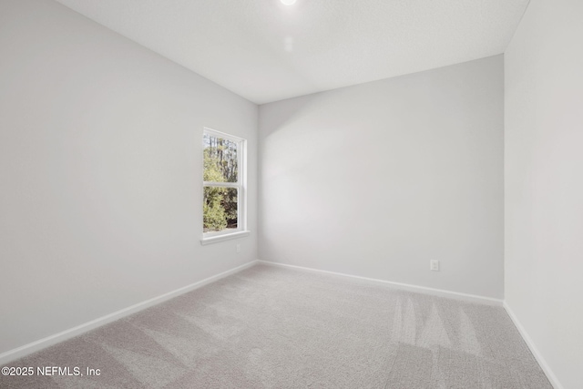 unfurnished room featuring carpet floors