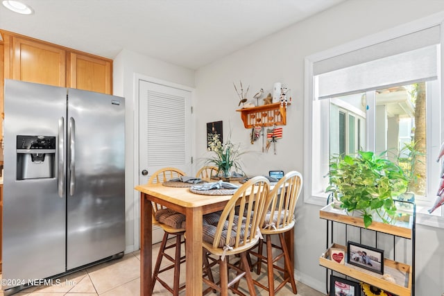 dining area featuring light tile patterned floors