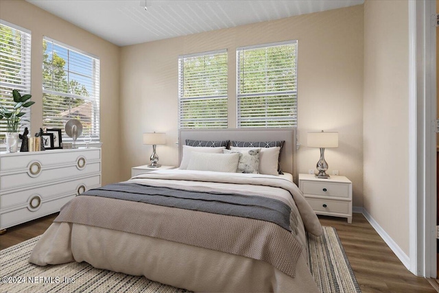 bedroom featuring dark hardwood / wood-style flooring