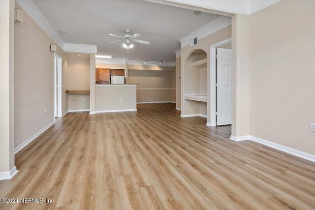 unfurnished living room with track lighting, light hardwood / wood-style flooring, ornamental molding, and ceiling fan