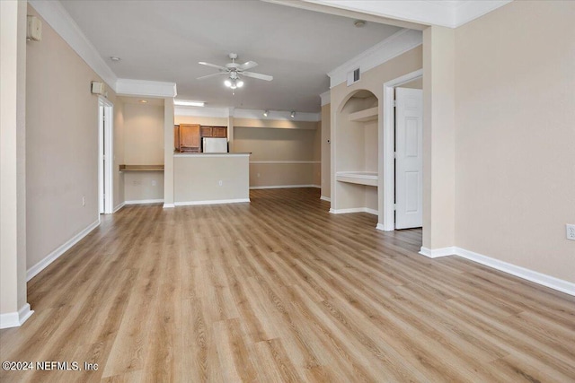 unfurnished living room featuring light wood-type flooring, ceiling fan, visible vents, and crown molding