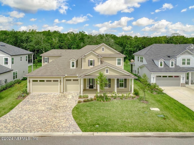 view of front of house with a garage and a front yard