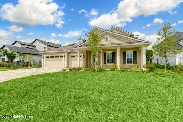 view of front of home with a garage and a front yard