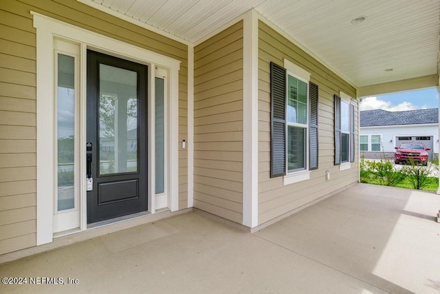 doorway to property featuring covered porch