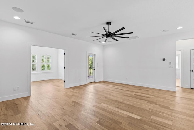 empty room featuring light wood-type flooring and ceiling fan