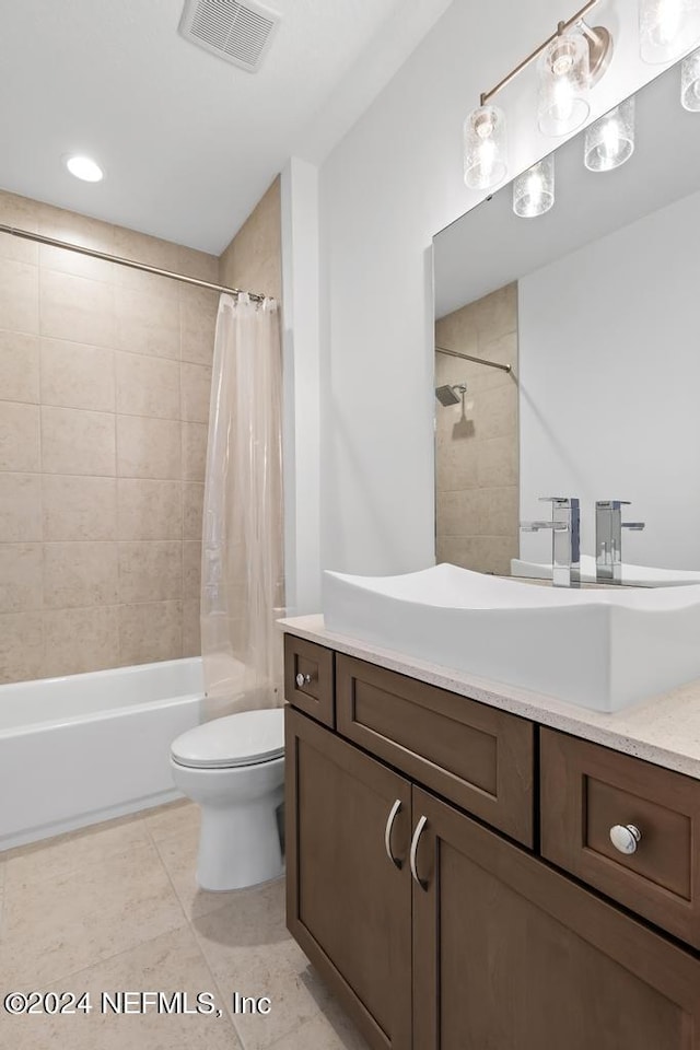 full bathroom featuring vanity, shower / bath combo, toilet, and tile patterned flooring