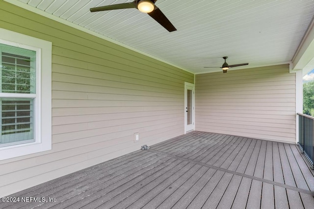 wooden terrace featuring ceiling fan