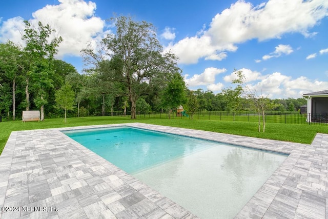 view of pool with a lawn and a patio area