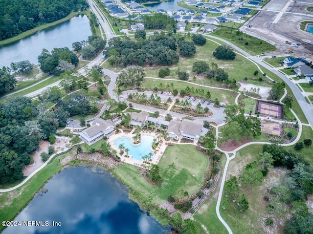 birds eye view of property with a water view