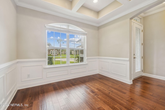 spare room with ornamental molding, coffered ceiling, and dark hardwood / wood-style floors