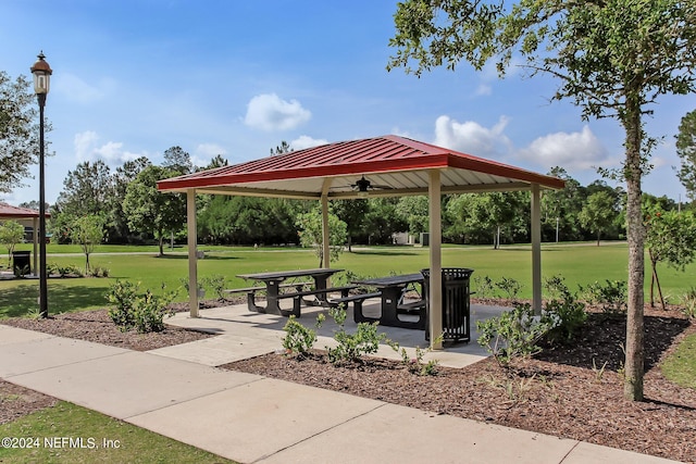 view of home's community with a lawn, a gazebo, and a patio area