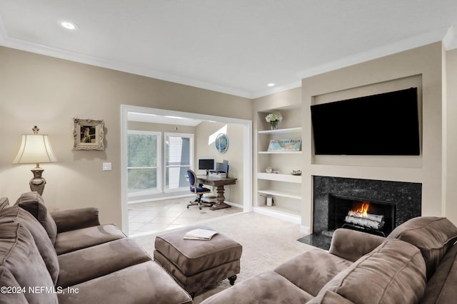 living room with built in shelves, a premium fireplace, crown molding, and light tile patterned flooring