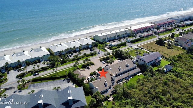 aerial view with a water view and a view of the beach