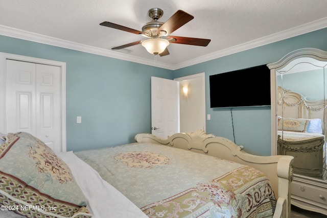 bedroom featuring a textured ceiling, a closet, ceiling fan, and ornamental molding