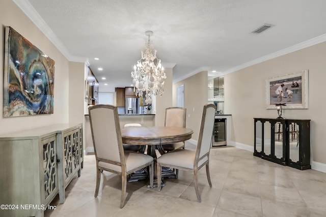 tiled dining area featuring wine cooler, crown molding, and a chandelier